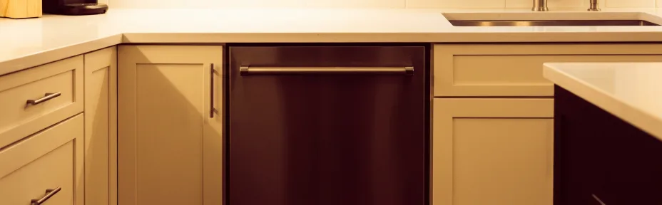 Quiet kitchen in the evening with a built-in dishwasher